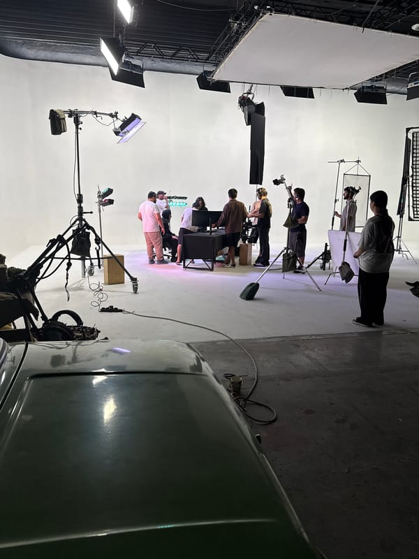 Studio production underway in Tashkent with crew and white backdrop