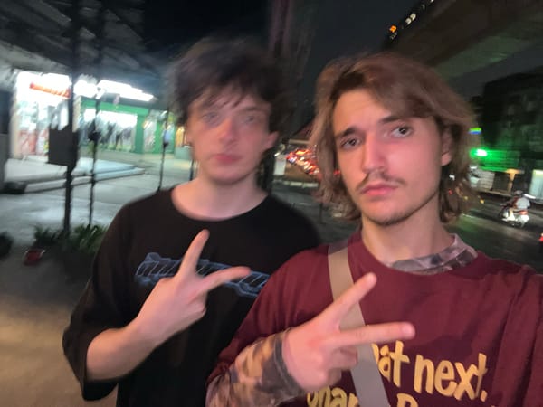 Friends pose for photo at Thai night market