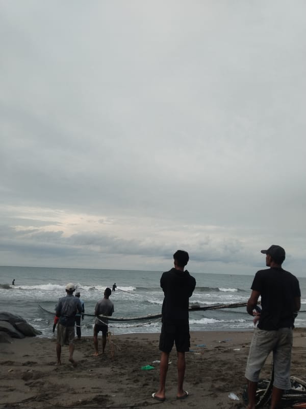 Traditional net fishing documented on Lhokseumawe beach, Indonesia