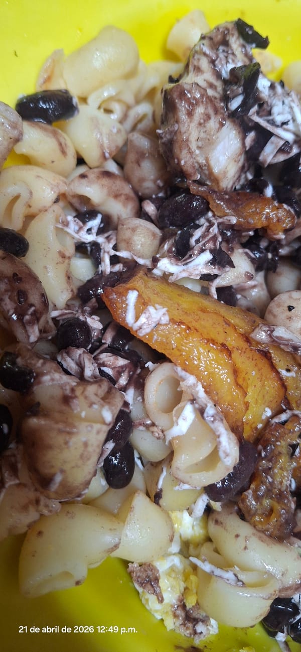 Mixed pasta dish with beans, cheese, plantains documented
