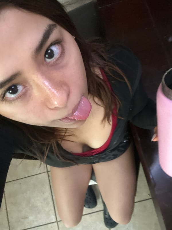 Woman takes selfies in bedroom in Puebla, Mexico