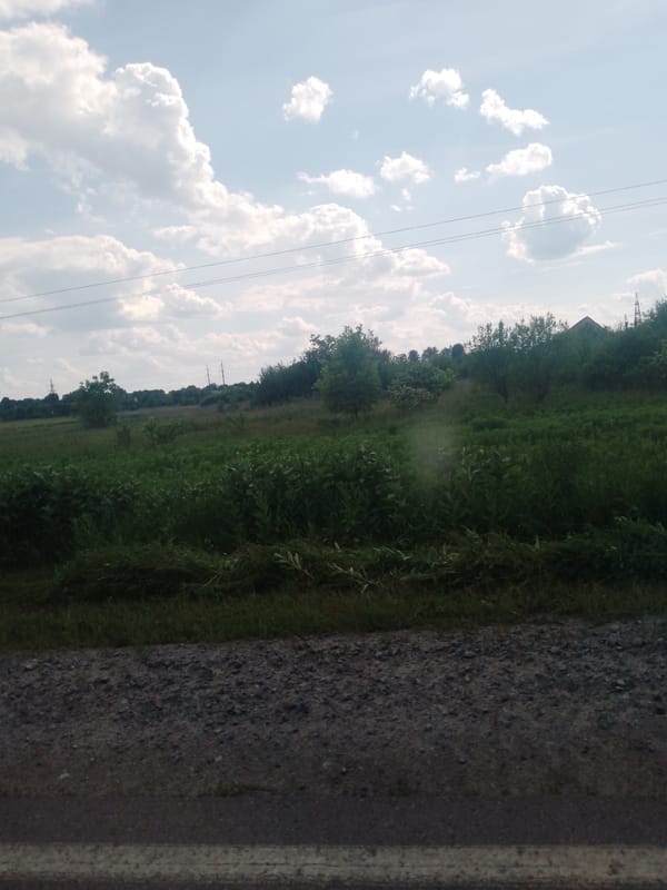 Rural road journey documented under cloudy skies June 6