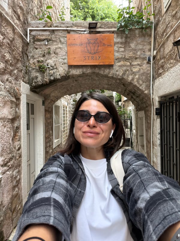 Morning street life captured in Budva's historic Old Town