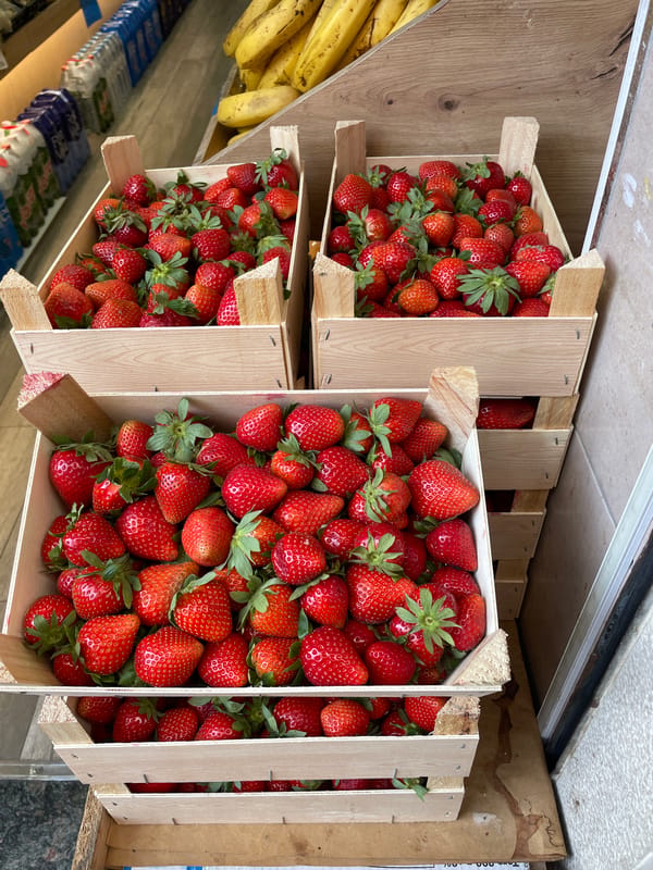 Strawberry crates displayed at Barcelona produce stand