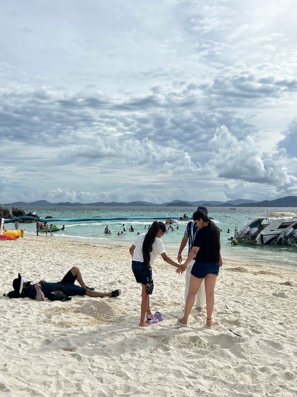 Busy tropical beach morning in Tambon Phru Nai, Phuket