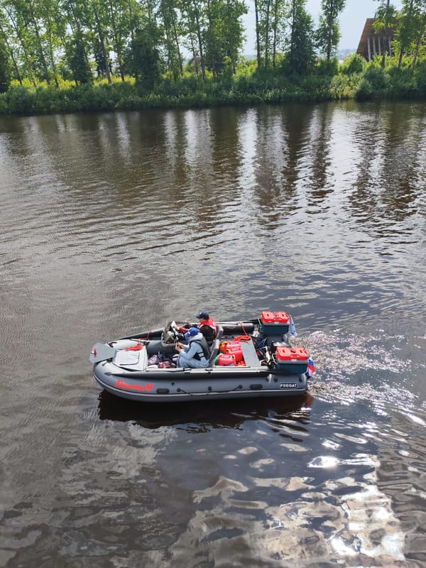 Two motorboats on the water near Selivanovo, Russia