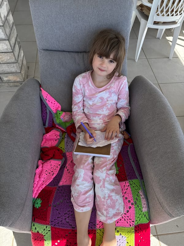 Mother and daughter enjoy quiet morning on Montenegro balcony