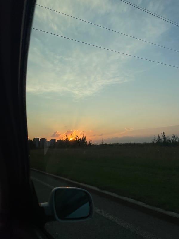 Driving through the city as the sun goes down