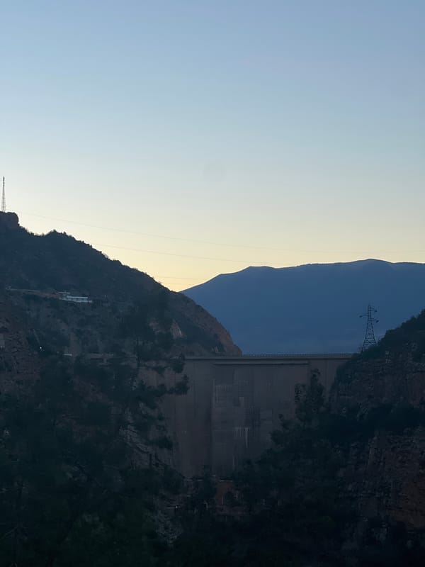 Full moon rises over Bin El Ouidane dam Morocco