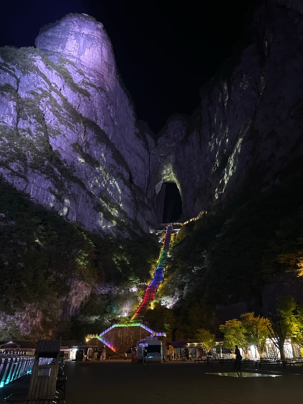 Tianmen Mountain illuminated purple and white at night