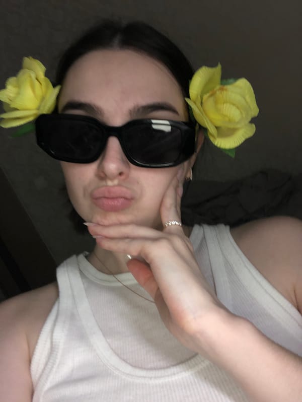 Woman photographed in multiple outfits during indoor photo session