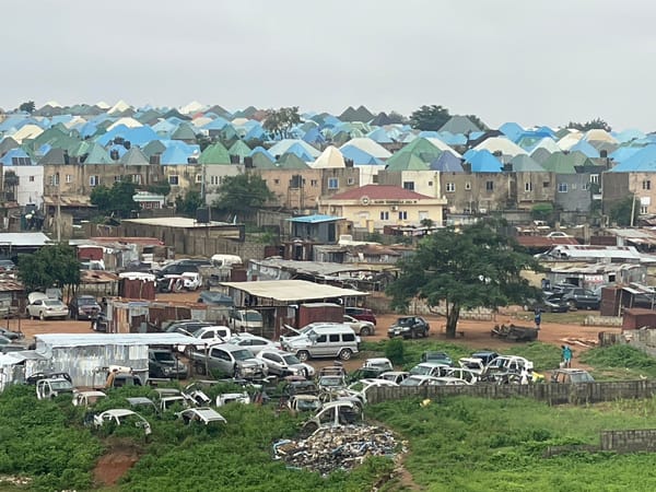 Abuja neighborhood mid-development, housing and construction side by side
