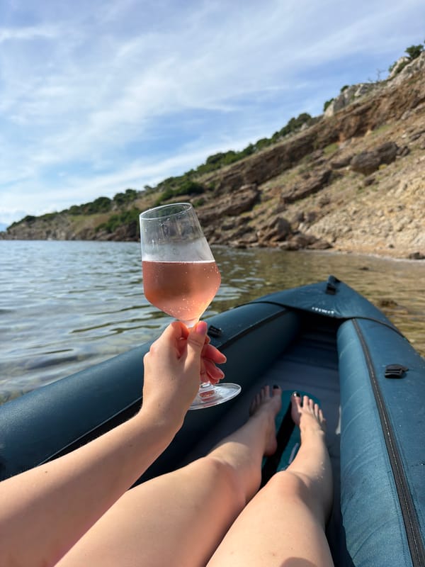 Beach day with kayaking, wine, and seashell collecting at scenic bay