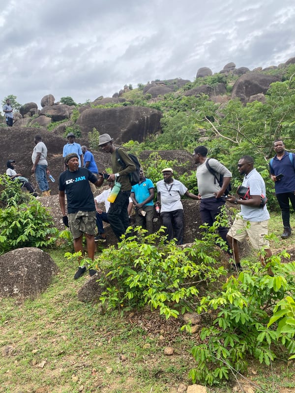 Hiking group explores rocky formations near Ganawuri, Nigeria