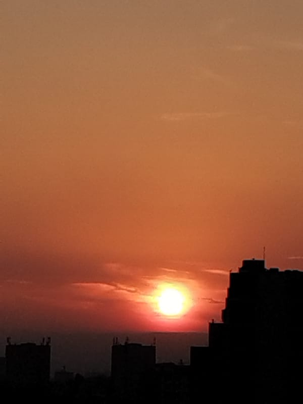 Witness documents golden hour sky over urban landscape