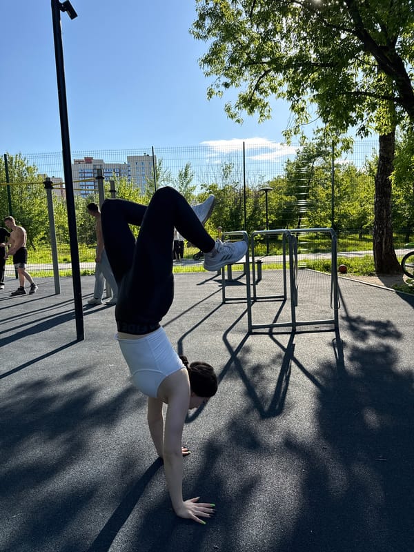Woman performs varied workout routine at outdoor fitness park