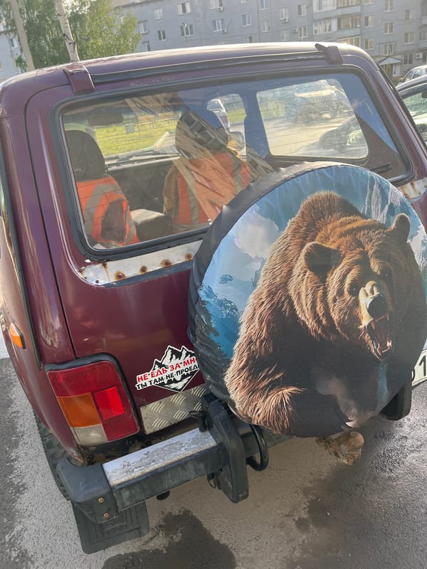 Maroon Lada Niva with spare tire observed in Ufa