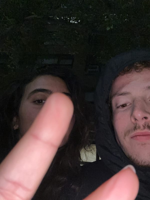 Two people take nighttime selfie in New York