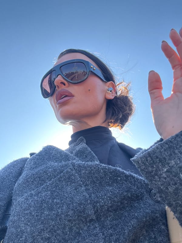 Woman photographs herself outdoors in Kent morning sun