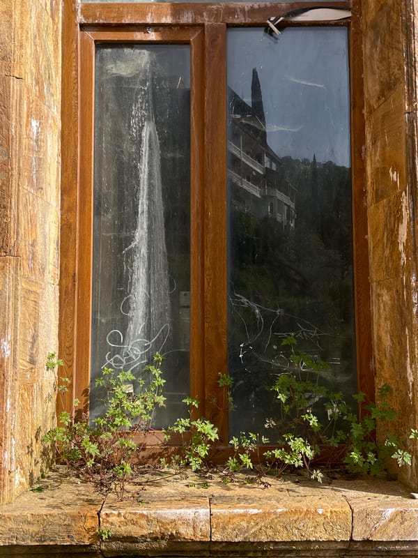 Tourist documents Abkhazia's weathered architecture and natural landscapes
