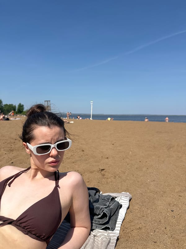 Woman photographed at multiple Chaikovsky waterfront locations over 13 minutes