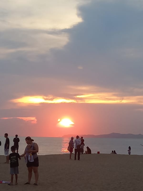 Crowds gather for sunset viewing on Pattaya beach