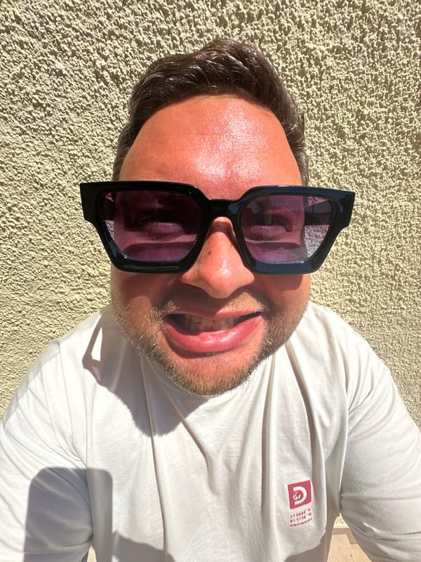 Man poses for eyewear social media content in Spanish coastal town