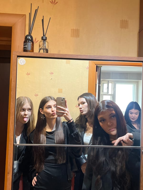 Young women take casual selfies indoors in Vsevolozhsk, Russia