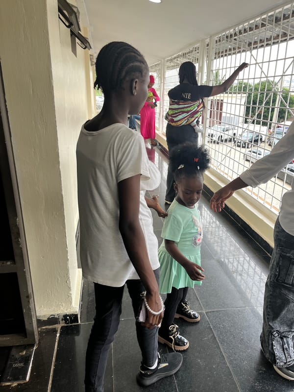 Morning foot traffic at a public facility in Abuja