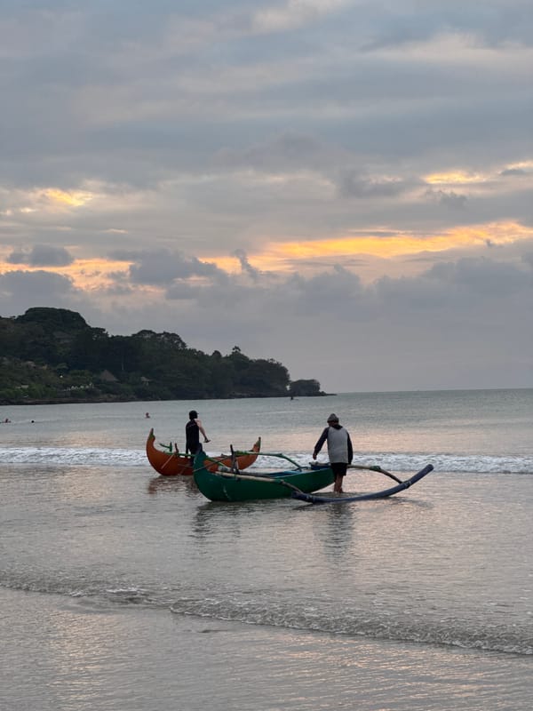 Sunset beach life in Kuta Selatan: horses, football, and fishing boats