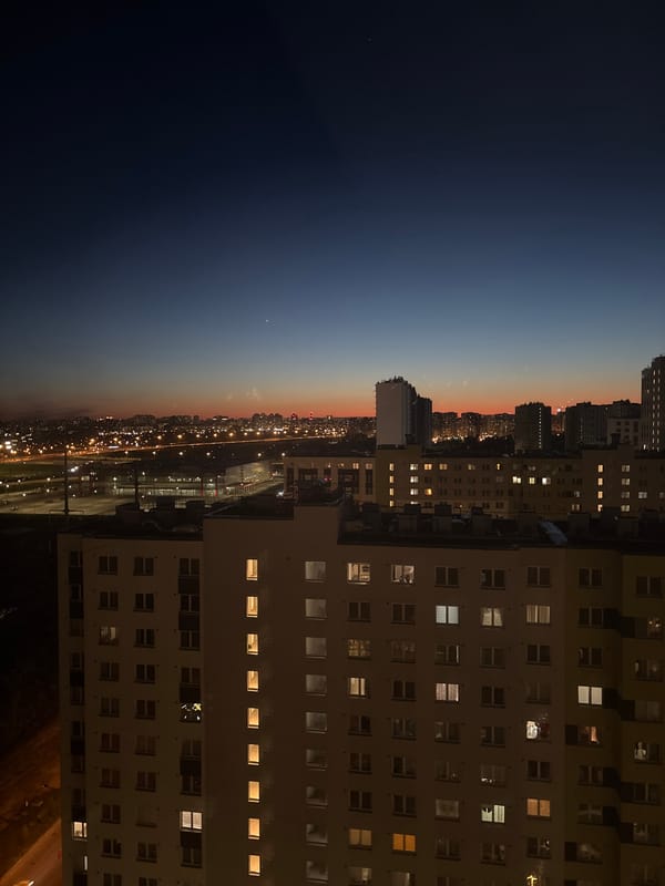 Evening lights illuminate apartment building in Vsevolozhsk, Russia