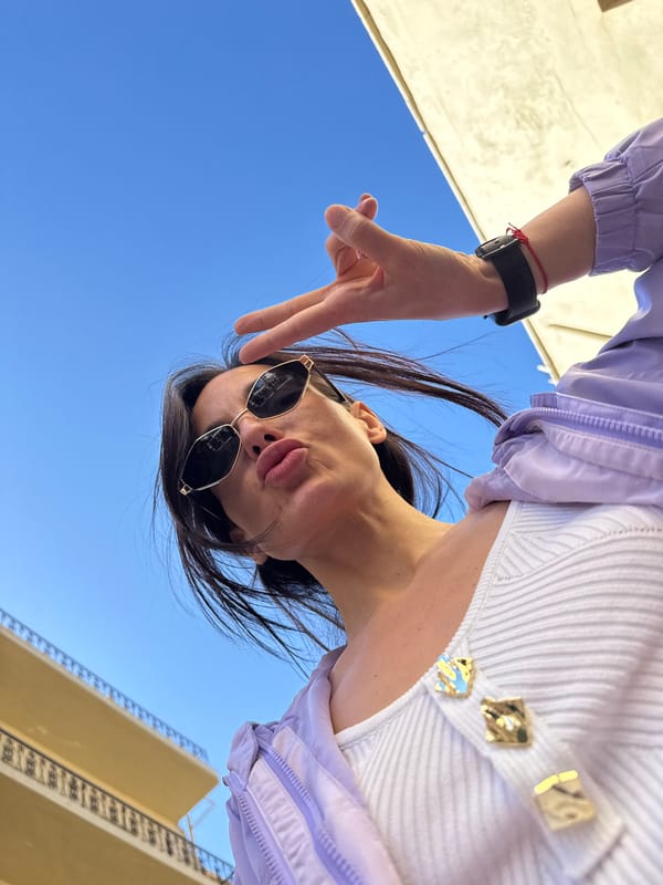 Woman takes selfie outside baby spa in Chania