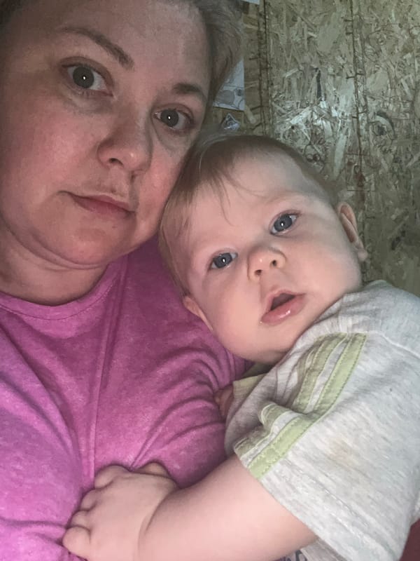 Baby photographed in multiple tender moments in Vesyoloye, Russia