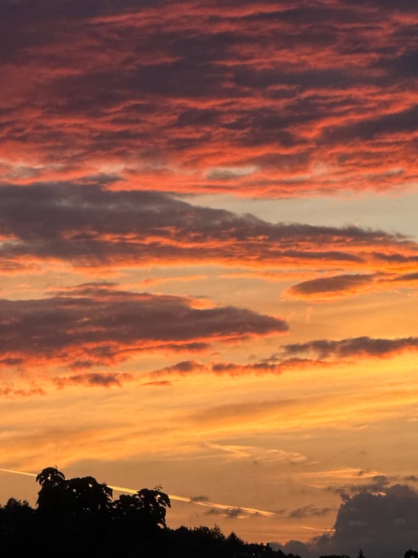 Vivid sunset clouds in purples, oranges, and pinks