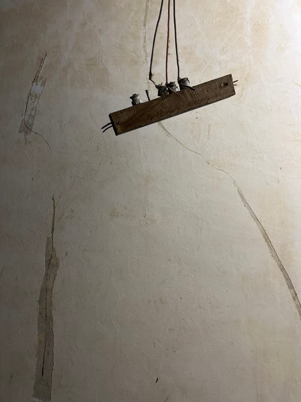 Inside a weathered Kota Kuala Simpang building, day into night