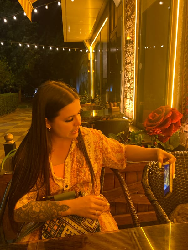 Late-night café stop in Derbent with cake and a cat