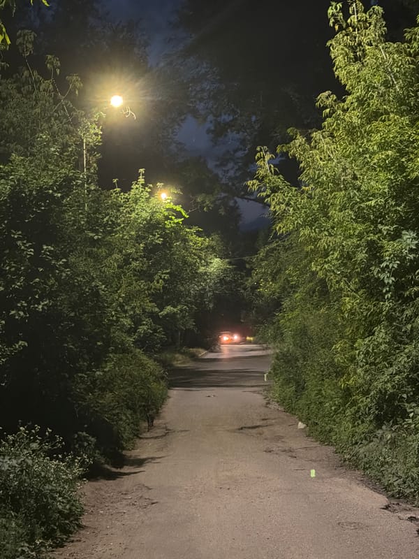 Roads, paths, and open sky across one evening
