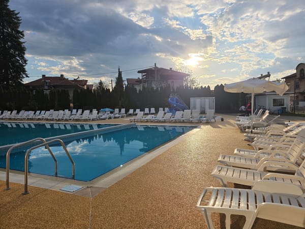 Evening sunlight illuminates outdoor pool in Dolna banya, Bulgaria