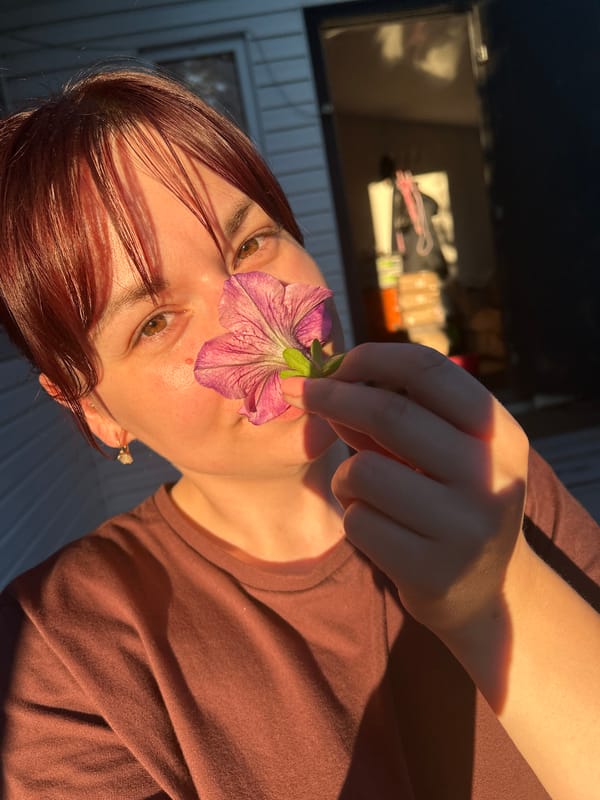 Backyard afternoon in Фоки: flowers, a dog, and coffee