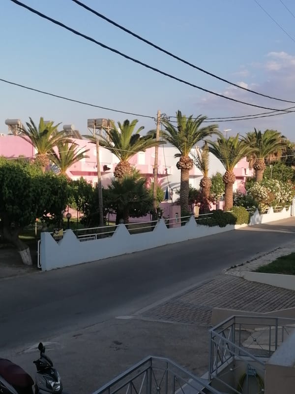 Inside and outside a Dramia, Crete venue on a summer afternoon