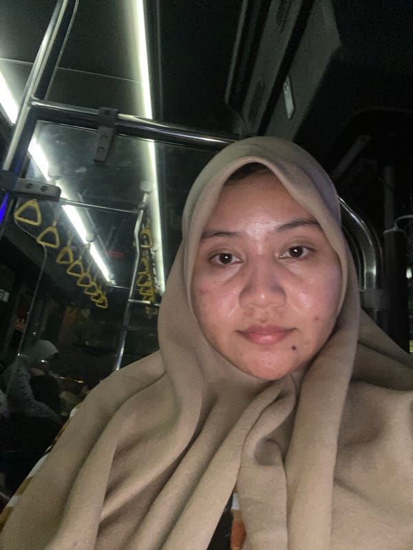 Night bus ride through rainy Banjarmasin streets