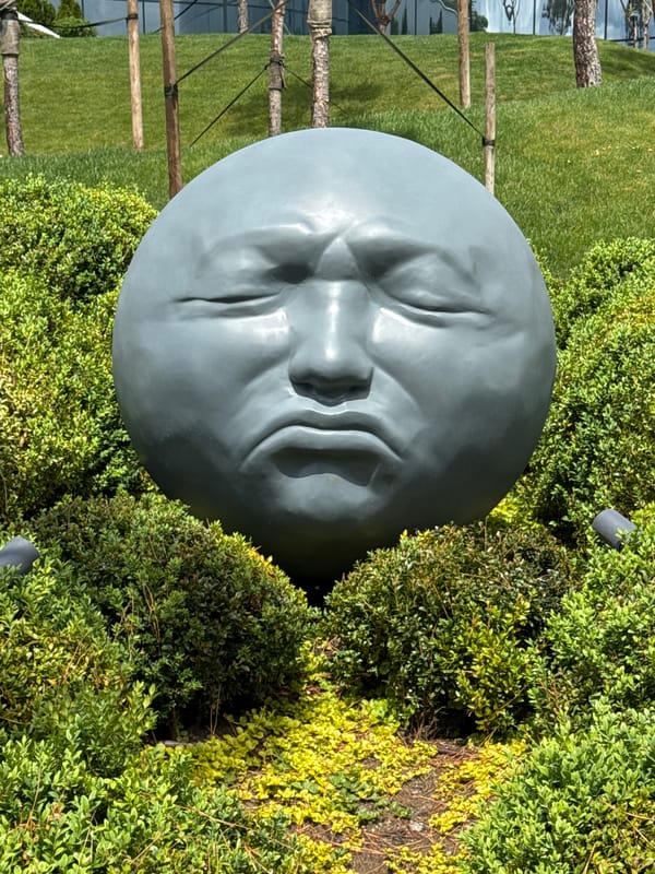 Melancholic head sculpture observed in Krasnodar park gardens