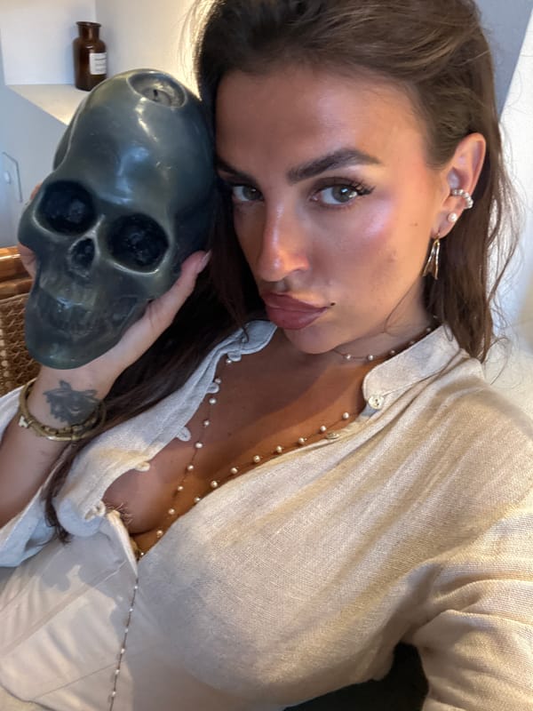 Woman poses with skull in multiple photos in North Kuta