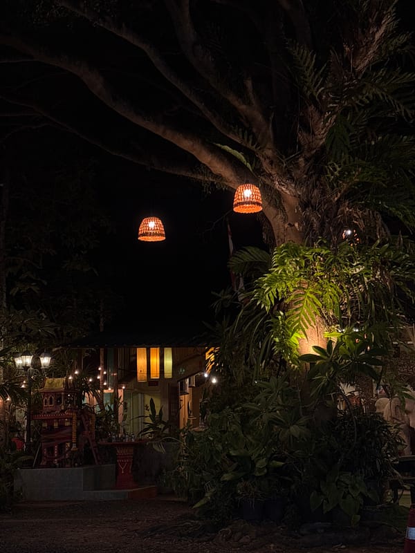 Lantern-lit pathway captured at night in Choeng Thale, Thailand