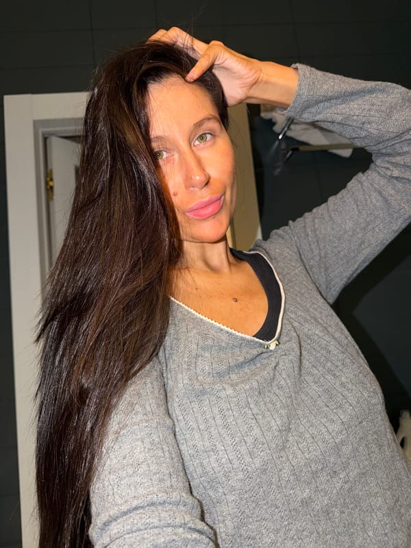 Woman takes mirror selfies in Khimki apartment
