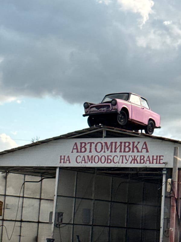 Pink Trabant on a car wash roof in Aytos, Bulgaria