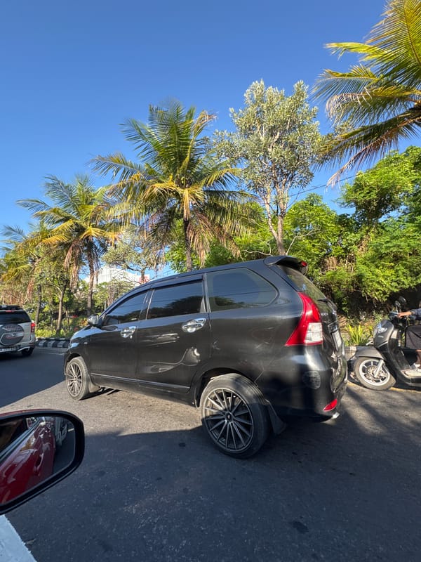 Car journey through traffic-congested Denpasar streets documented