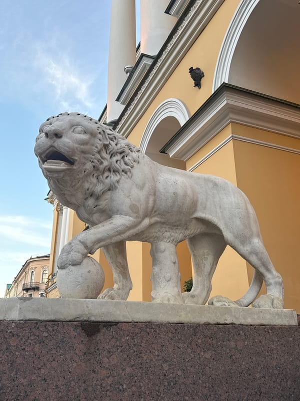 Saint Petersburg landmarks and lion statues on a June evening