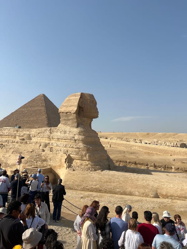 Tourists visit Great Sphinx and pyramids at Giza