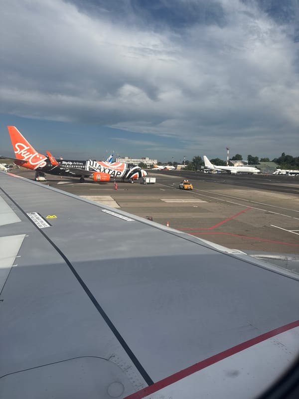 Airplane window view over Chișinău International Airport tarmac